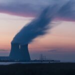 Large energy plant with smoke coming out of a large stack