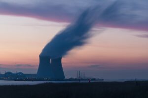 Large energy plant with smoke coming out of a large stack