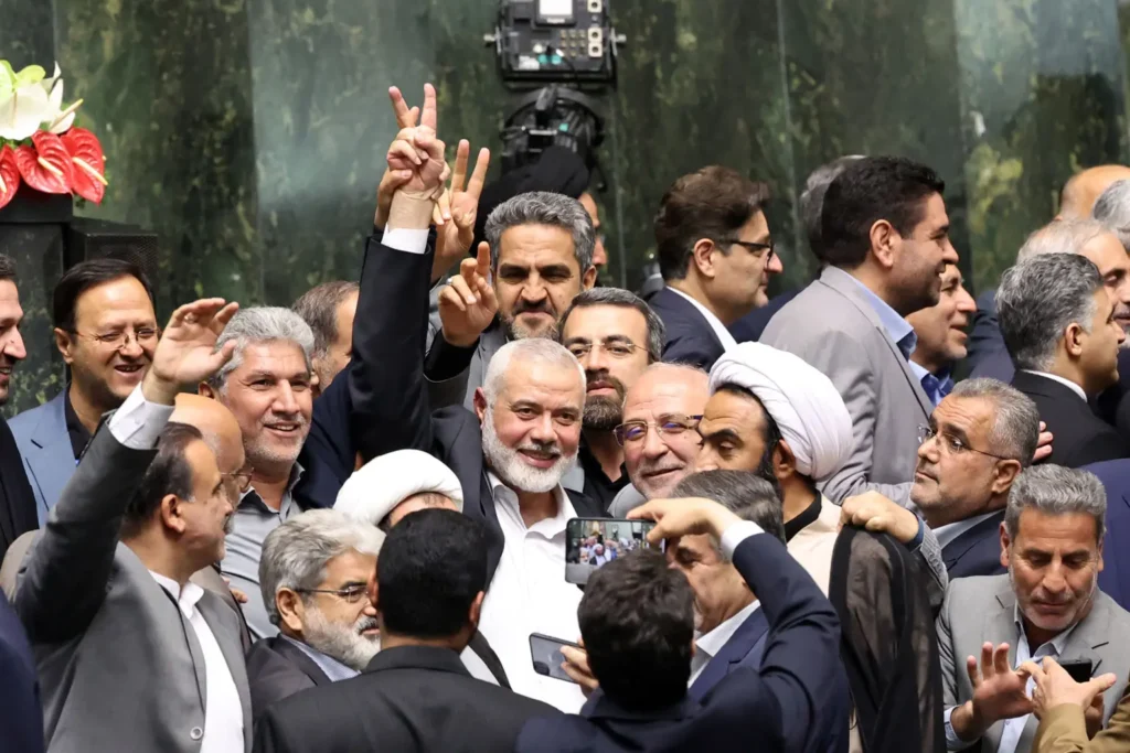 Hamas' former leader flashes a victory sign before Israel assassinated him this week with a direct strike in Iran.