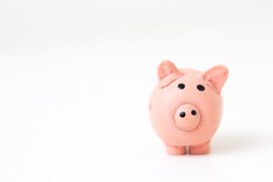 Pink piggy bank on a white background